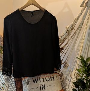 Sheer black long sleeved blouse